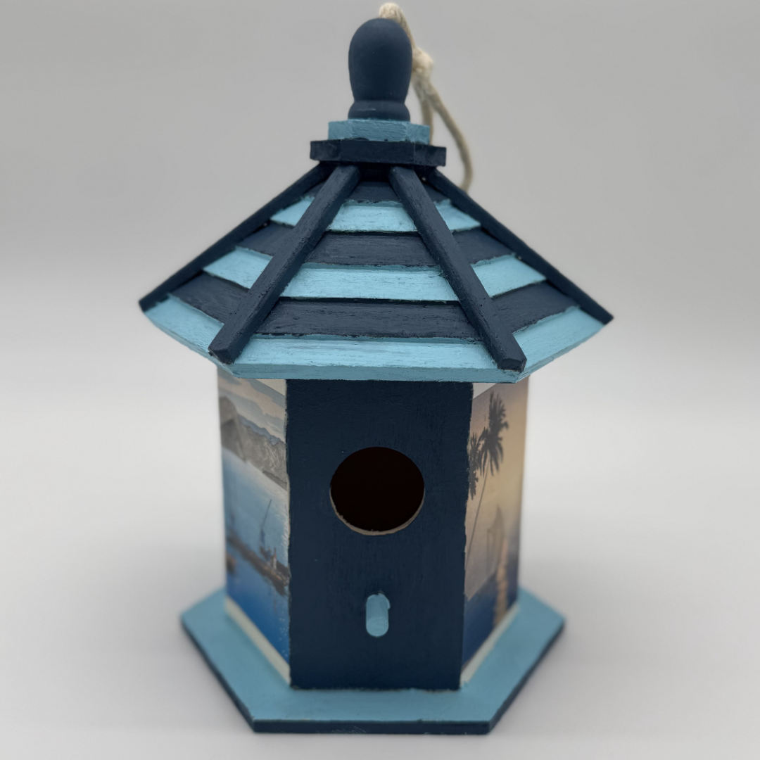 Decorative birdhouse with blue and navy design on a white background