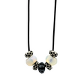 Necklace with decorative beads on a light gray background