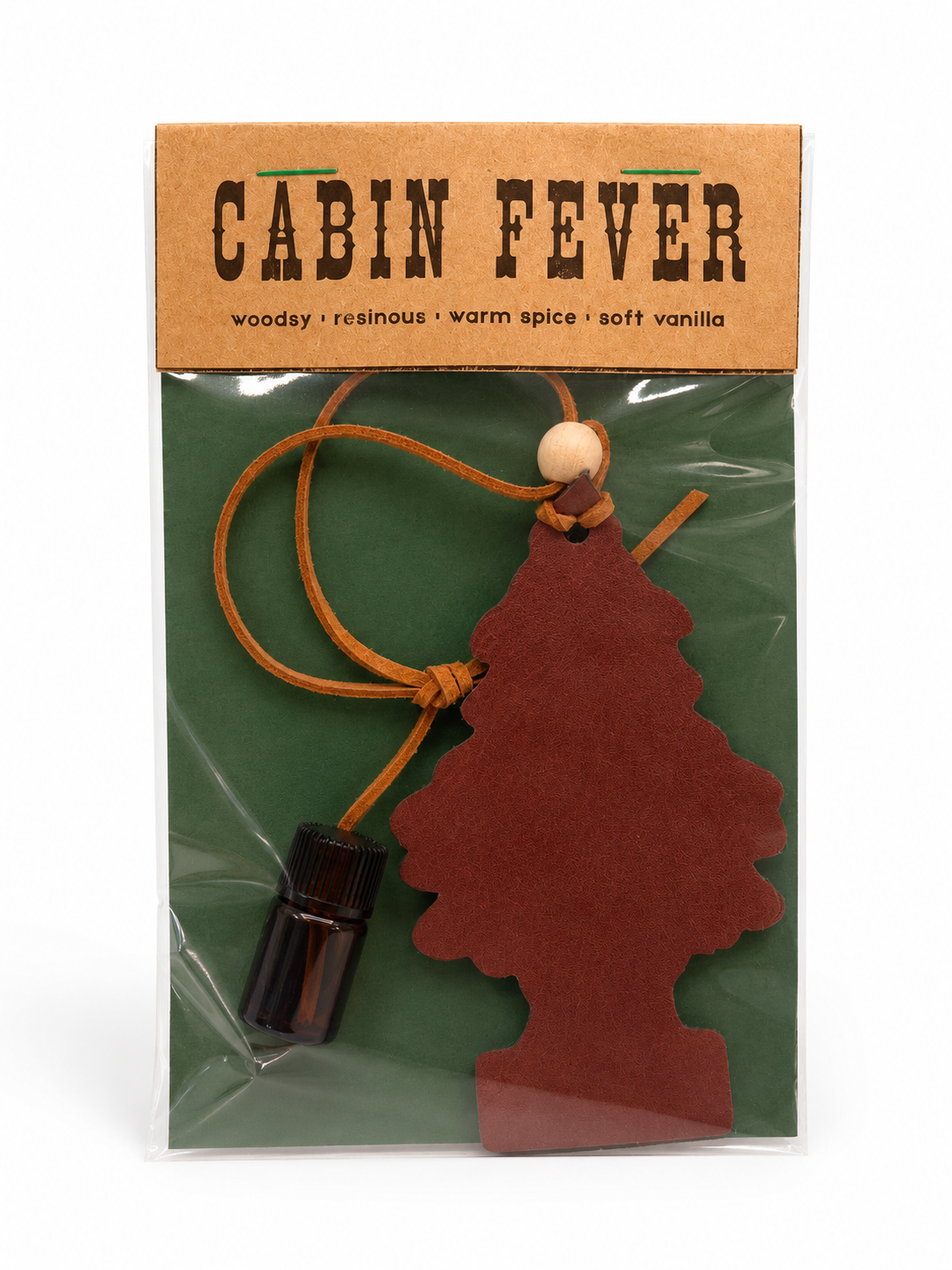 Cabin Fever air freshener packaging with a tree-shaped car air freshener and small bottle on a white background.